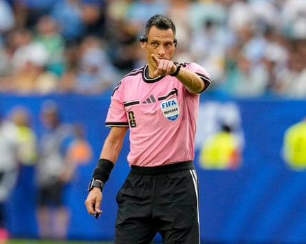Maurizio Mariani points at a player during the game