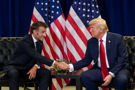 Emmanuel Macron and Donald Trump shake hands