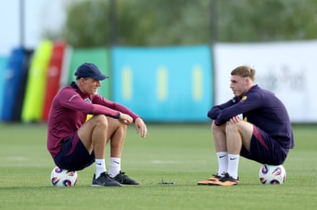 Thomas Tuchel talks to Cole Palmer at England training in Girona.