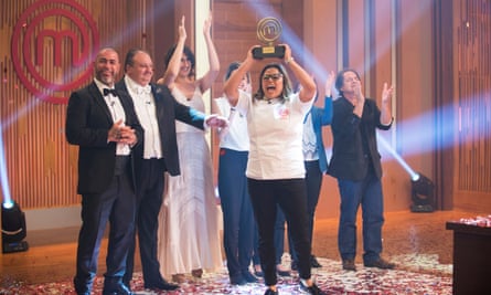 Dayse Paparoto holds up her trophy after winning MasterChef Professionals in Brazil.