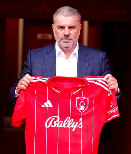 Ange Postecoglou with a Nottingham Forest shirt.