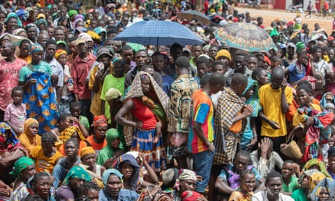 Displaced people from the province of Cabo Delgado gather to receive humanitarian aid from the World Food Program (WFP) in Mozambique.