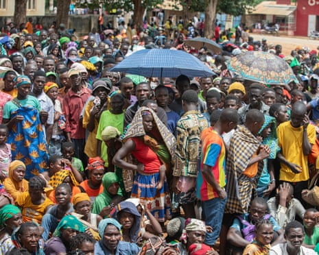 Displaced people from the province of Cabo Delgado gather to receive humanitarian aid from the World Food Programme in Namapa, Mozambique, in February 2024.