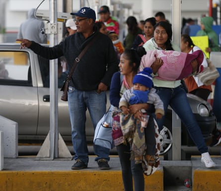 David Barragan, centre, stands with others who fled their homes after their towns were taken over by FUPCEG vigilantes.