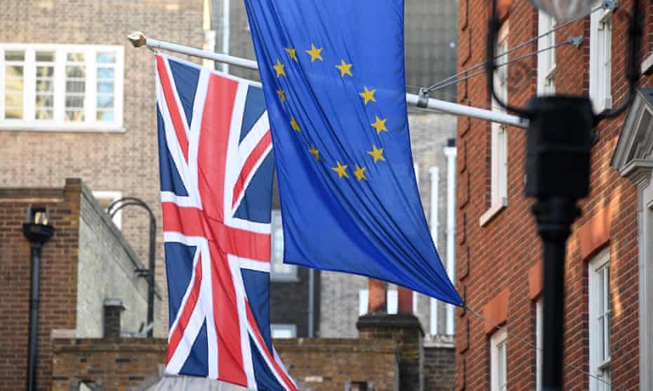 The EU and union jack flags fly side by side outside the Europa House in Westminster in London.