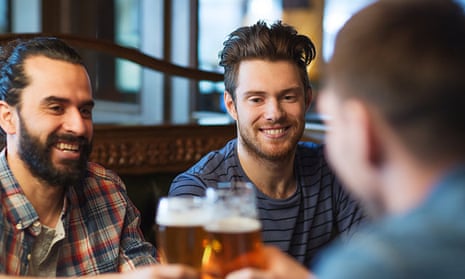 Men drinking in pub