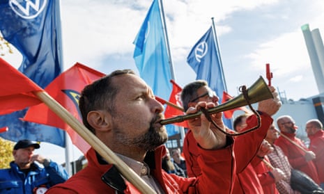 Employees of the Volkswagen plant in Zwickau stand on the factory premises during an information event organised by the Works Council of Volkswagen on 28 October.