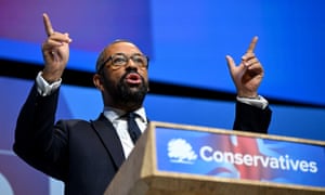 James Cleverly speaking from a lectern labelled 'Conservatives'