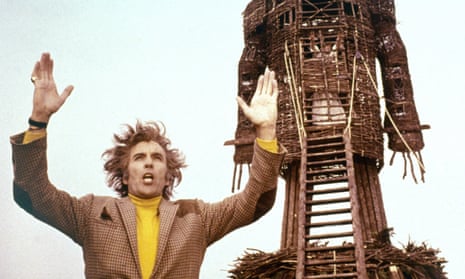 Christopher Lee with wicker man behind