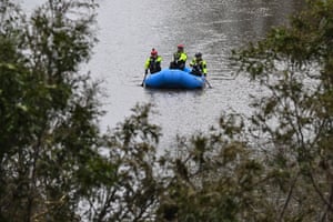 people ride in a raft on a river