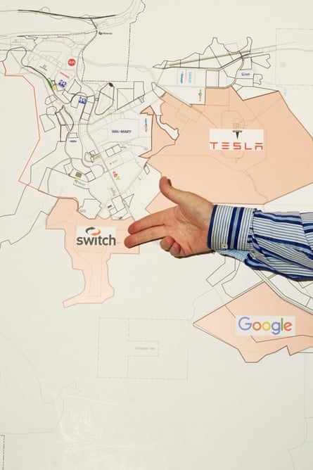 A person pointing two fingers at a point on a map.