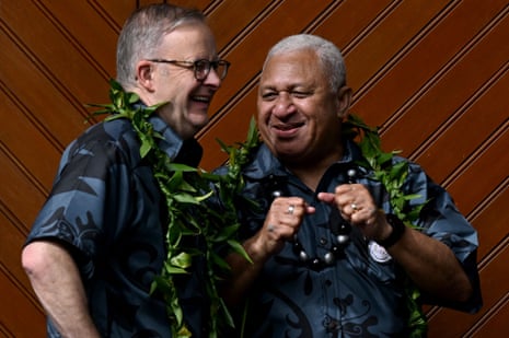Australian prime minister Anthony Albanese (L) shares a lighter moment with Fiji prime minister Frank Bainimarama during the family photo at the Pacific Islands Forum (PIF) in Suva