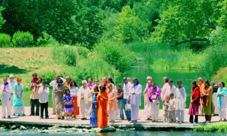 Alice Coltrane Turiyasangitananda (in orange, centre) and devotees