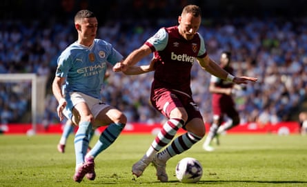 West Ham’s Vladimir Coufal is challenged by Manchester City’s Phil Foden