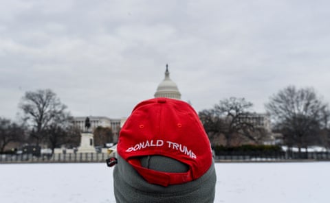 A man wearing a Trump hat