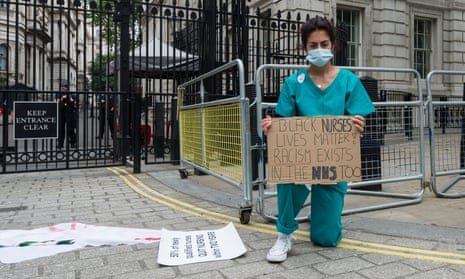 An NHS nurse protests outside Downing Street, London, 3 June 2020