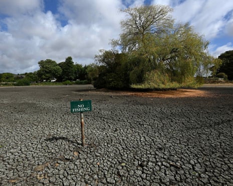 A 'No Fishing' sign is pictured in the dried up Falmer Pond in Falmer, East Sussex, south of London.