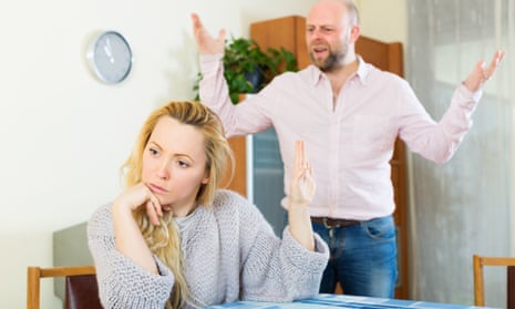 Woman signalling her angry partner to be quiet
