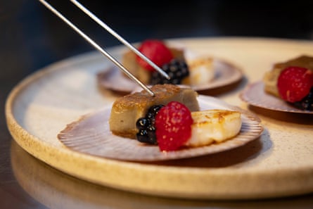Foie gras served seared with scallop, berries and micro-greens