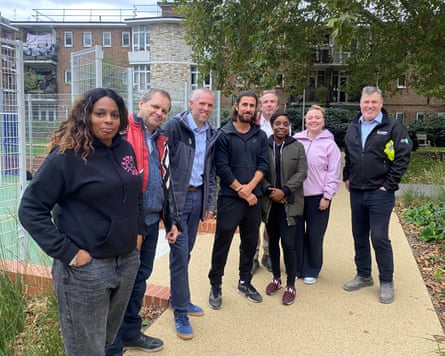 Shae Clarke, left, of Patmore youth group, with the council development team. Aydin Dikerdem, cabinet member for housing, is in the centre.