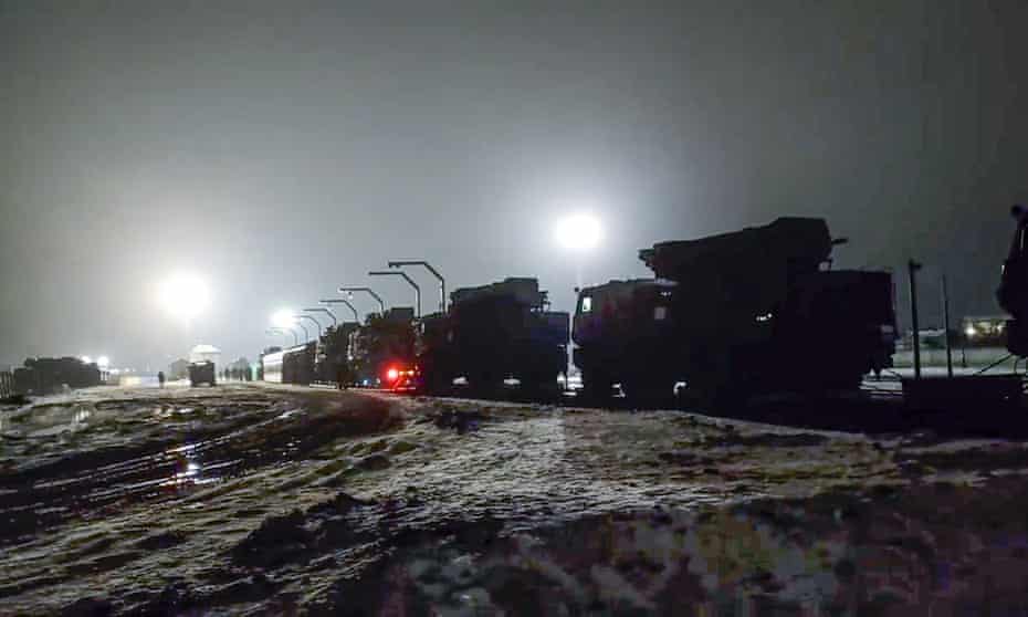 Russian military vehicles arrive in Belarus, near the border with Ukraine, on 29 January.