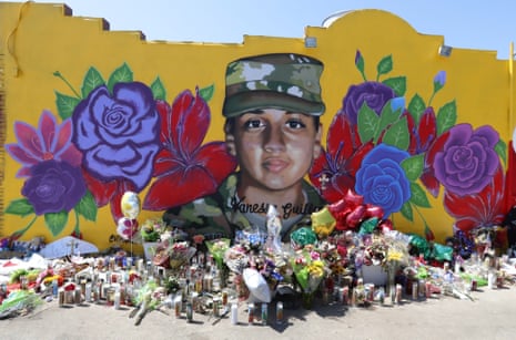 Offerings sit in front of a mural of the slain army specialist Vanessa Guillén painted on a wall in the south side of Fort Worth, Texas.
