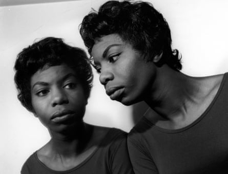 A woman’s mirrored portrait in black in white.