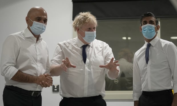 Sajid Javid, Boris Johnson and Rishi Sunak during a visit to a hospital.