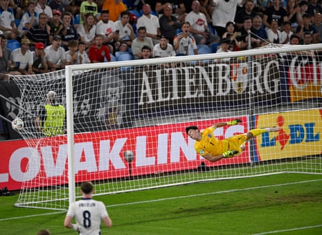 England's keeper James Beadle dives but fails to save a header from Germany’s Nelson Weiper.