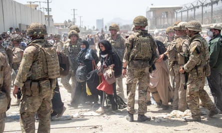 Members of the British and US military engaged in the evacuation of people out of Kabul