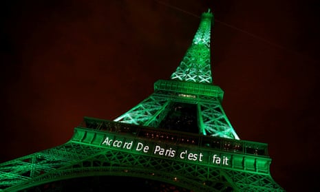 The Eiffel tower is illuminated in green with the words “Paris agreement is done”, to celebrate the Paris climate agreement