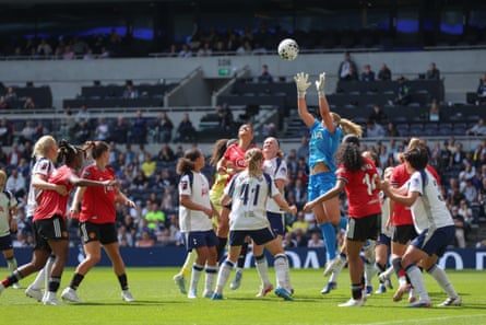 The Tottenham goalkeeper, Lize Kop, deals with a corner during the draw against Manchester United.