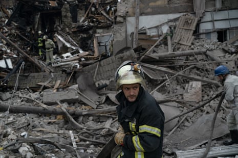 A firefighter works after an attack heavily damaged a building in Sloviansk.