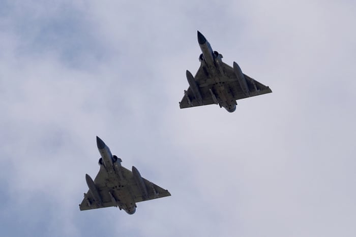 Two Taiwanese Air Force Mirage 2000-5 fighter jets fly by an airbase in Hsinchu, Taiwan, on Sunday 7 August.