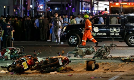Motorcycles lie on the street at the scene of the explosion near the Erawan shrine in central Bangkok.