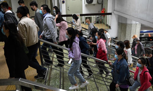 People walk in the subway as the outcome of the seventh national population census by the National Bureau of Statistics of China, are released in Beijing