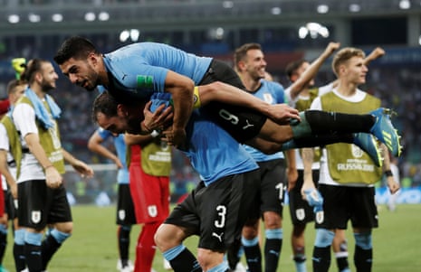 Uruguay’s Diego Godin and Luis Suarez celebrate after the match.