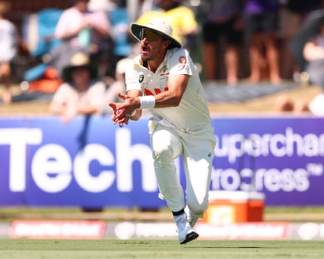 Mitchell Starc holds a catch in the deep to dismiss Tanzid Hasan during day two of the first Test between Australia and Bangladesh