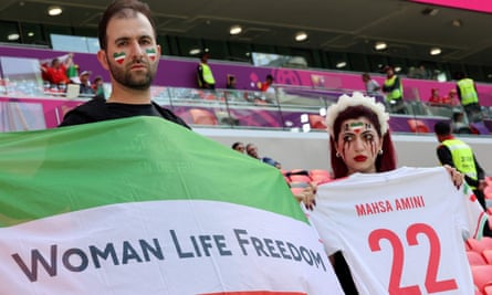 Iran supporters protest during the match against Wales.