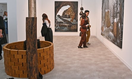 People check out the artworks in a room at the Frieze event