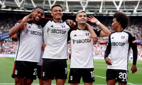 Andreas Pereira (second right) celebrates with Alex Iwobi (left), Rodrigo Muniz and Willian (right).