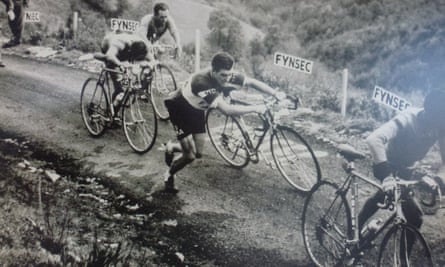 A photograph of cyclists struggling up the Muro Di Sormano in the 1960s, shown at the Museo Di Ciclismo at the Madonna Del Ghisallo, Como, Italy.