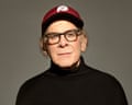 Portrait of Art Garfunkel in black jumper and baseball cap