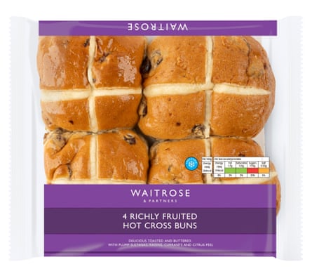 Four Waitrose Hot Cross Buns in a clear packet