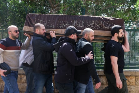 Mourners carry the coffin of Lebanese man Mohammed Zain Al-Abidin Shehab