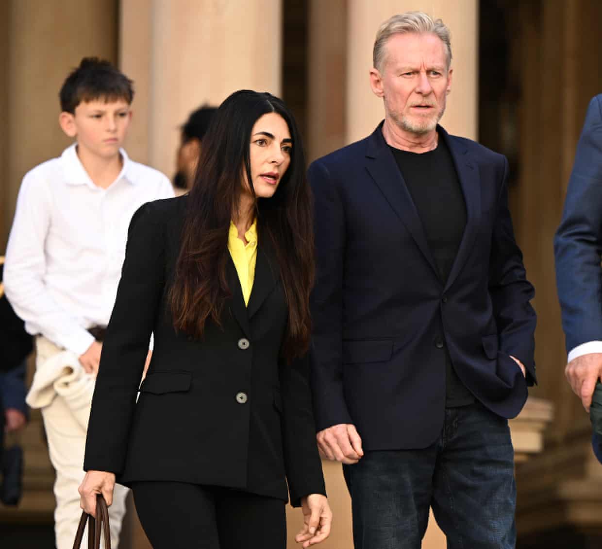 Silvia Colloca and Richard Roxburgh leave the memorial service commemorating the life and career of James Valentine.