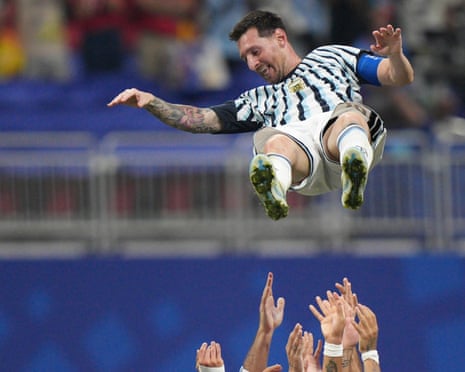 Lionel Messi is tossed into the air by his Argentina teammates