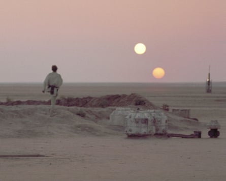 A mournful Luke Skywalker contemplates a double sunset in a memorable scene from Star Wars