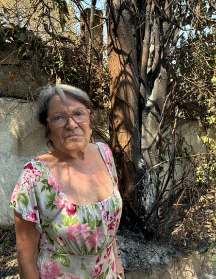 Mercedes Merino, 70, in her burnt garden near Madrid