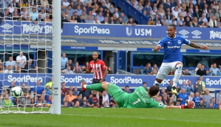 Everton’s Theo Walcott scores their first goal.